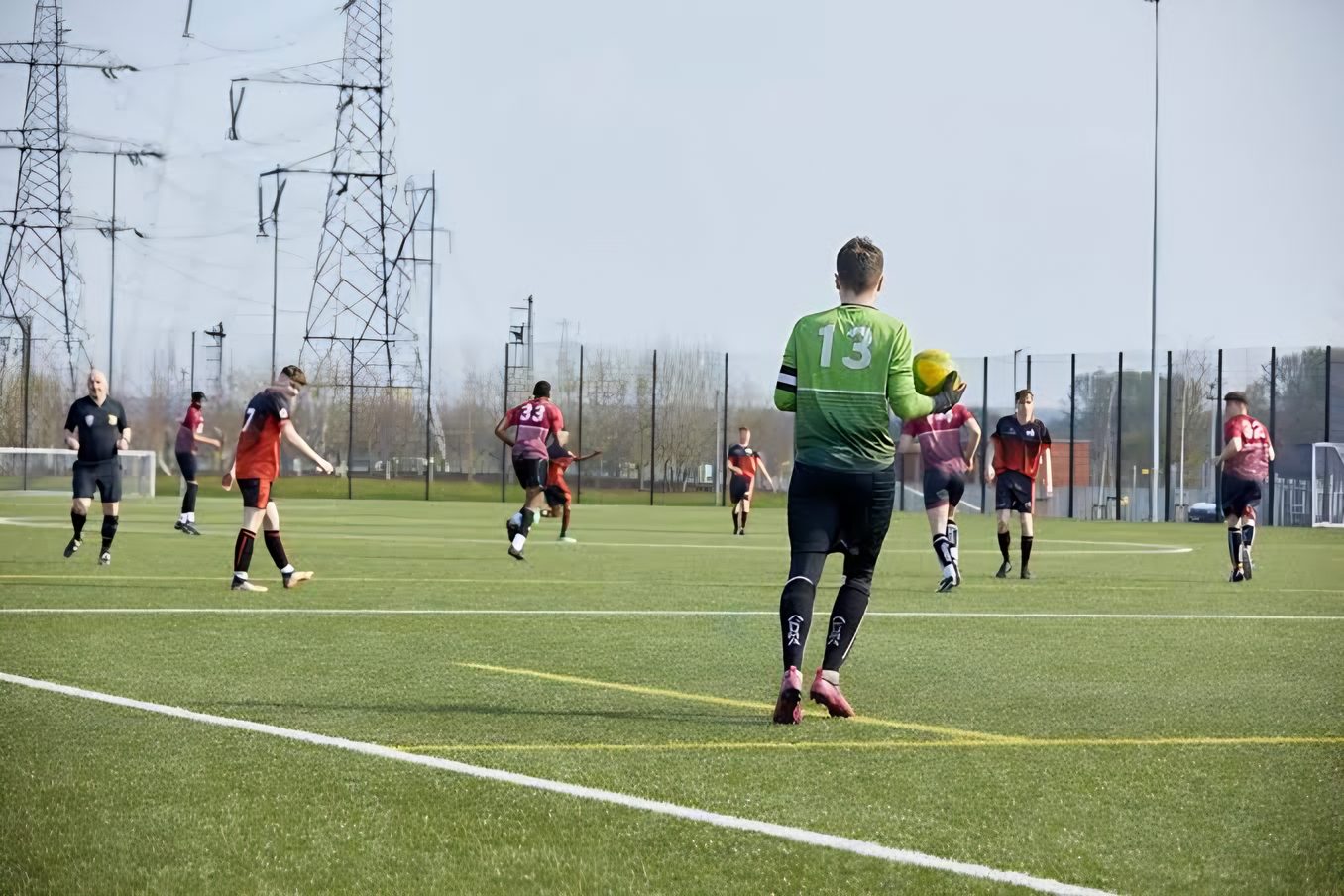 A goalkeeper takes a high ball during a game on the Waterside 3G